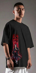 Man wearing oversized black t-shirt with red anime graphic and streetwear styling