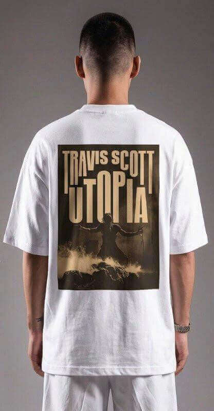 Back view of a white oversized graphic tee with bold sand-gold print, featuring rock and mist design.